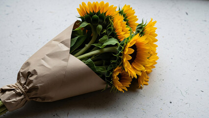 Beautiful Bouquet of Fresh Yellow Sunflowers Wrapped in Kraft Paper