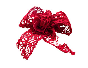 A detailed, isolated shot of an elaborate red lace bow, centered on a black background
