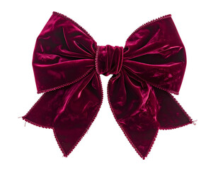 Luxurious, vibrant burgundy velvet bow with detailed folds and edges against a black backdrop