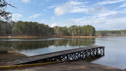 The boat ramp at Maynor Creek Water Park near the city of Waynesboro, MS. Pine forest reflects in the water.