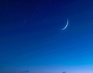 A Crescent Moon Shines Brightly in a Starry Night Sky Over a Faint Horizon