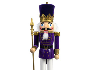A decorative purple toy soldier nutcracker with crown and staff against a dark backdrop