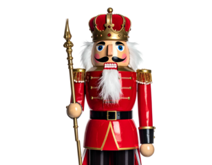 A festive, ornamental soldier stands tall, holding a staff, adorned in red and gold regalia
