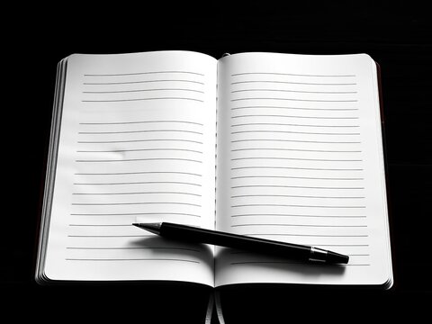 Classic black and white composition notebook open to lined pages, ready for notes,  writing,  office