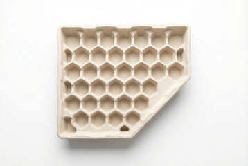 Empty molded pulp tray with hexagonal pattern