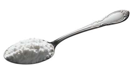 Spoon with white powder on black background silver spoon