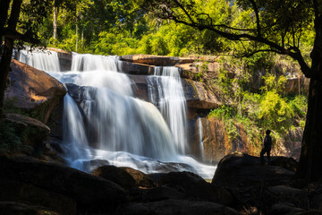 The landscape of Tat Hueang waterfall during sunrise.