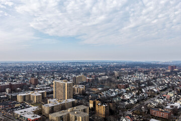 Fototapeta premium Foggy aerial drone photo of Mount Vernon New York with overcast winter sky and dense neighborhoods, image 60