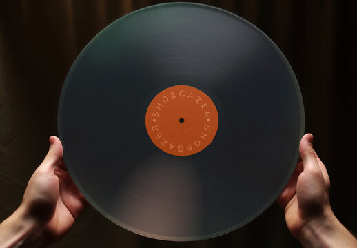 Hands Holding Transparent Vinyl Record Mockup PSD