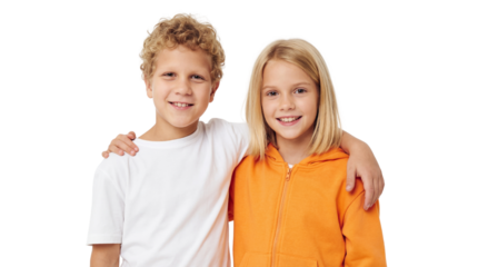 Smiling boy with curly hair and girl in orange hoodie