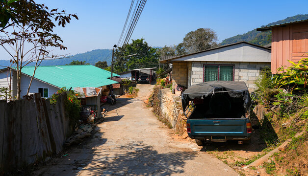 Traditional hillside home with a rustic carport in the Hmong Doi Pui Village nestled in the lush mountains of Chiang Mai, Northern Thailand