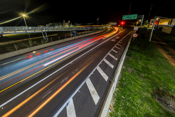 Nighttime vehicle traffic at the intersection of highways, which pass through the city in Brazil