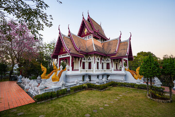 Obraz premium Traditional Thai ordination hall with Naga serpents at Wat Santikhiri at dusk in Mae Salong, Chiang Rai Province, Northern Thailand