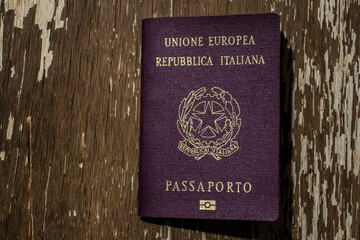 Close-up of the cover of a burgundy biometric Italian passport, an official travel document of the Italian Republic and a symbol of European Union citizenship, identity, and freedom of movement.