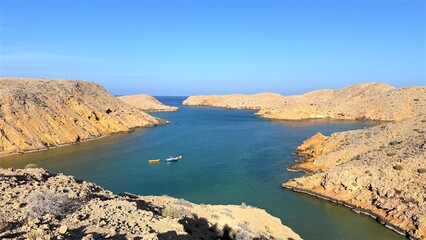 Peaceful Harbor View, Relaxed Seaside Setting Showcasing Anchored Ships Bright Rays Of Sunshine, Tranquil Coastal Landscape Displaying Anchored Vessels And Shimmering Sunlight Illuminating Calm Bay