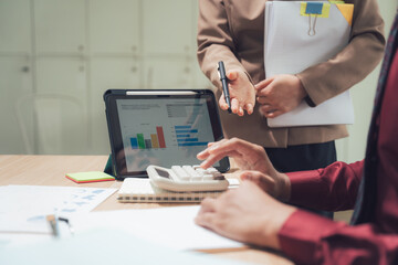 Financial Planning and Analysis: Professional collaborators analyze intricate financial data, utilizing charts and digital tools to strategize and make informed decisions.