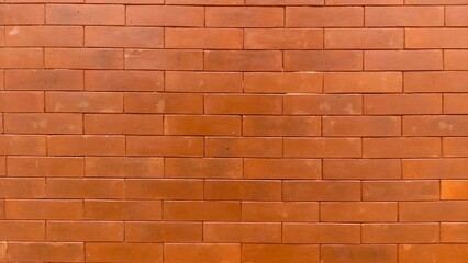 Obraz premium Red brick wall texture with clean pattern, ideal for backgrounds, architecture visuals, construction themes, and design mockups. Perfect for designers, advertisers, publishers, and educational content