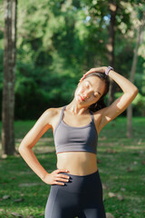 Fototapeta premium Woman stretching neck outdoors practicing health and wellness