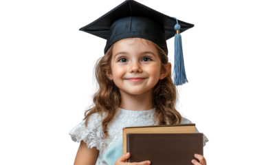 Smiling young girl in a graduation cap holding books, isolated on transparent background