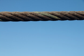 Close-up of a durable steel sling showcasing strong metal fibers and industrial strength.