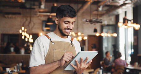 Fototapeta premium Restaurant, happy man and waiter reading with tablet, table management and online service platform. Review reservation, browsing menu update and server with tech for info, check app and order status