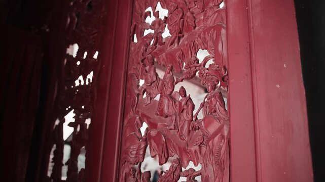 Intricately carved openwork on a Chinese door frame.