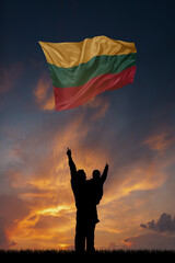 Father with son and the flag of Lithuania for national independence day