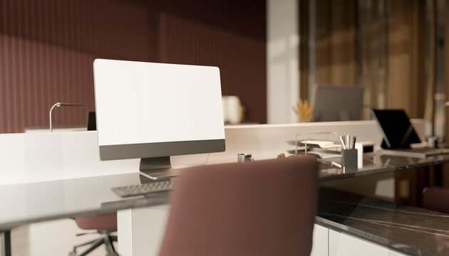 Modern office workspace with blank computer screen and no people