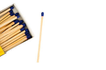 A wooden match with a blue head lies next to an open matchbox, isolated on a transparent background