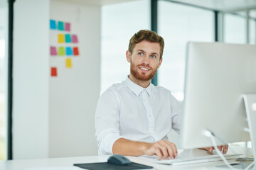 Man, smile and thinking with computer for design proposal, insight and inspiration at company. Person, graphic designer and pc with perspective, review and happy for feedback at creative agency
