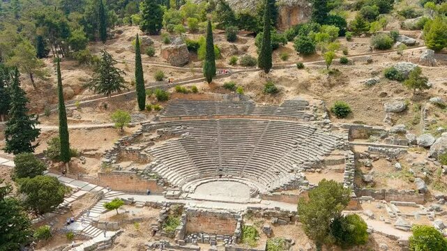 Delphi, Greece. Ruins of the ancient city of Delphi. Sunny weather, Summer. Drone footage, Departure of the camera