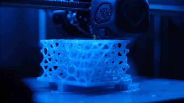 3D printer creating object. Technology, innovation, manufacturing, printing process