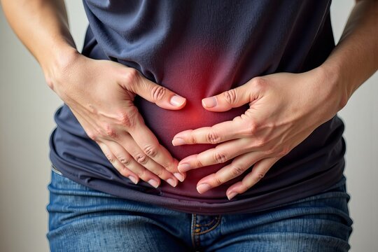 A woman's hand clutching her crotch in pain: A poignant depiction of the challenges of living with bowel incontinence