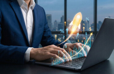 Startup business growth concept. Businessman pointing at rising bar graph with rocket icon, percentage sign and upward arrows, symbolizing success, investment return, and financial innovation.