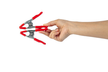 A studio shot of a red stainless spring clamp in hand isolated on a transparent background