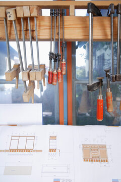 Bench vises and blueprints in a carpentry workshop in Schaeftlarn