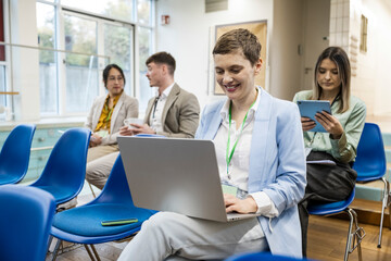 Business team collaborating in modern office coworking space with technology