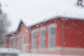 Raindrops on the window glass, Icy flowers - frozen window