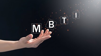 A hand presenting floating blocks spelling out the letters m b and t