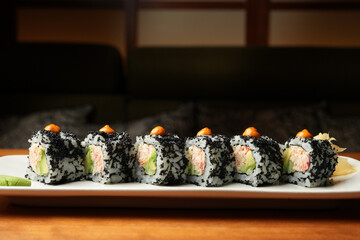 Gourmet Black Tobiko Sushi Rolls with Crab and Avocado © Gecko Studio