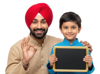 Smiling Sikh father in traditional attire makes an OK gesture while standing beside his young son holding a blank framed chalkboard