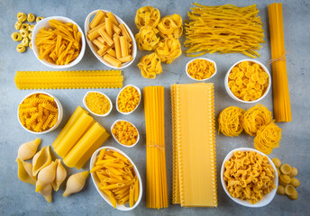 Composition with different tasty uncooked pasta - Italian pasta wallpaper, different types and shapes of pasta layout