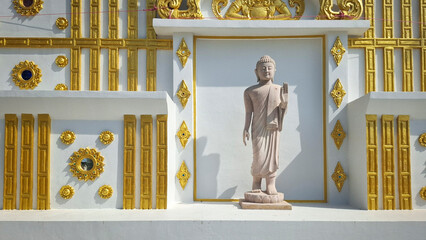 white buddhist temple with statue of buddha
