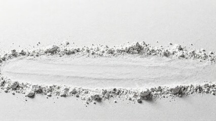 White powder and pebbles in linear arrangement