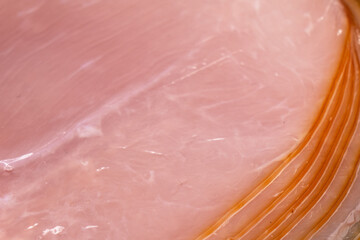 Sliced smoked beef meat in vacuum package texture background. Raw smoked packaged meet