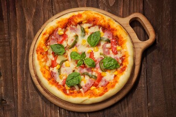 Delicious homemade Margherita pizza and ingredients