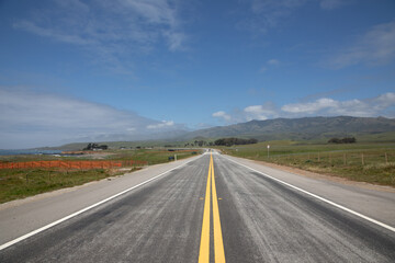 cabrillo highway and street, the california state route 1 or CA1 with fields and yellow median