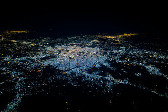 Aerial view of Baghdad city at night with Tigris river meanders, Iraq