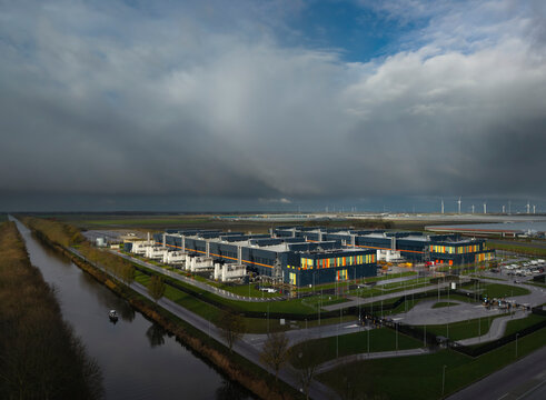 Modern data center with dark clouds in Middelmeer The Netherlands