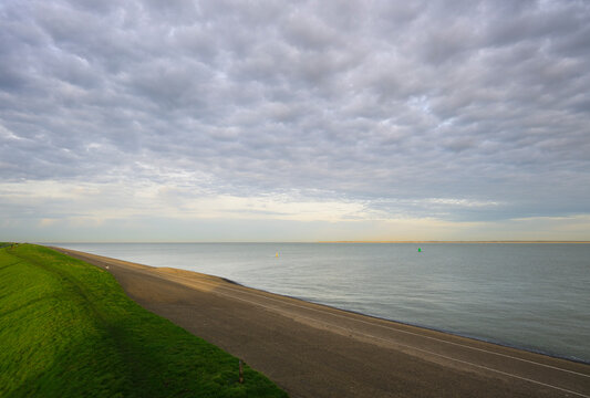 Dyke and Waddensea coast in early morning at Den Helder Netherlands